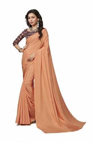 Rich And Elegant Looking Plain Saree IS Here In Light Orange Color Paired With Brown Colored Digital Printed Blouse. This Saree And Blouse Are Fabricated On Crepe Silk Which Is Light Weight, Soft Towards Skin And Easy To Carry All Day Long. 