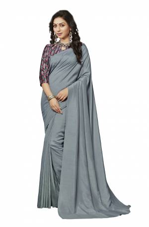 Simplicity Is The Key To Elegance, Grab This Very Pretty Simple And Elegant Looking plain Saree In Steel Grey Color Paired With Multi Colored Digital Printed Blouse. Both The Saree And Blouse Are Crepe Silk Based Which also Ensures Superb Comfort all Day Long. Buy Now.
