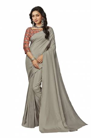 Rich And Elegant Looking Plain Saree IS Here In Grey Color Paired With Multi Colored Digital Printed Blouse. This Saree And Blouse Are Fabricated On Crepe Silk Which Is Light Weight, Soft Towards Skin And Easy To Carry All Day Long. 