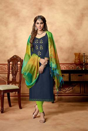 If Those Readymade Suit Does Not Lend You The Desired Comfort Than Grab This Pretty Dress Material In Navy Blue Color Paired With Light Green Colored Bottom And Multi Dupatta. This Dress Material Is Cotton Based Paired With Art Silk Fabricated Dupatta. Get This Stitched As Per Your Desired Fit And Comfort.
