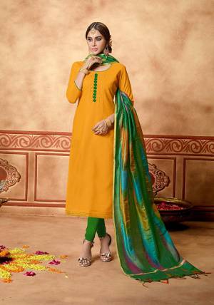For A Bold And Beautiful Look, Grab This Pretty Dress Material In Musturd Yellow Colored Top Paired With Light Green Colored Bottom And Multi Colored Dupatta. Its Top Is Fabricated On Cotton Slub Paired With Cotton Bottom And Art Silk Fabricated Dupatta. 