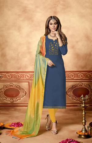 Simple And Elegant Looking Straight Suit Is Here In Navy Blue Colored Top Paired With Yellow Colored Bottom And Multi Colored Dupatta. Its Top And Bottom Are Cotton Based Paired With Art Silk Fabricated Dupatta. Its Top Is Beautified With Hand Work. 