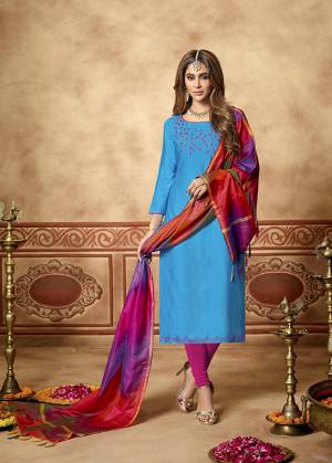 Here Is A Very Pretty Dress Material For Your Semi-Casual Wear In Blue  Color Paired With Magenta Pink Colored Bottom and Red And Purple Dupatta. Its Top Is Fabricated On Cotton Slub Paired With Cotton Bottom And Art Silk Dupatta. All Its Fabrics Ensures Superb Comfort All Day Long. 