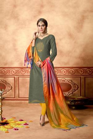 If Those Readymade Suit Does Not Lend You The Desired Comfort Than Grab This Pretty Dress Material In Olive Green Color Paired With Yellow  Colored Bottom And Multi Dupatta. This Dress Material Is Cotton Based Paired With Art Silk Fabricated Dupatta. Get This Stitched As Per Your Desired Fit And Comfort.