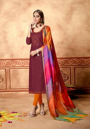 Simple And Elegant Looking Straight Suit Is Here In Maroon Colored Top Paired With Orange Colored Bottom And Multi Colored Dupatta. Its Top And Bottom Are Cotton Based Paired With Art Silk Fabricated Dupatta. Its Top Is Beautified With Hand Work. 