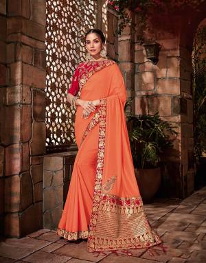 The saffron-red colors weaved beautifully with golden threads in traditional paisley motifs makes this saree a classic piece. Add on dainty jhumkis to look beautiful. 