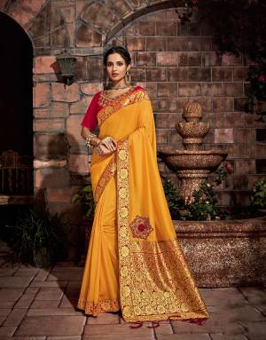 The perfect yellow golden shade of the magnificent sun with contrast red and gold details is a six-yard royalty. Pair it with oranate jewels to look ethereal. 