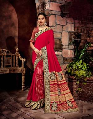 A meticulous match of stripes and floral details in classic shade of red , black and gold is a pivotal aspect of this saree.  Add a choker necklace to perfect the look. 