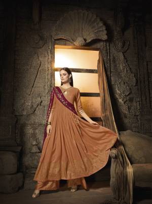 Grab This Very Beautiful Designer Suit In Rust Orange Color Paired With Contrasting Maroon Colored Dupatta. Its Very Top And Bottom Are Fabricated On Muslin Which Is Light Weight And Soft Towards Skin Paired With Chiffon Fabricated Dupatta. Its Unique Pattern And Color Pallete Will Earn You Lots Of Compliments From Onlookers, 