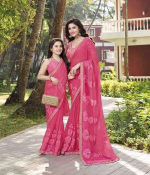 Look Pretty Wearing This Pretty Designer Saree In Pink Color Paired With Pink Colored Blouse. This Saree Is Chiffon Based Paired With Art Silk Fabricated Blouse. It Is Beautified With Tone To Tone Embroidery. 