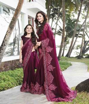 Here Is A Very Pretty Designer Saree In Wine Color Paired With Wine Colored Blouse. This Saree Is Fabricated On Silk Georgette Paired With Art Silk Fabricated Blouse. It Has Very Pretty Tone To Tone Embroidery. 
