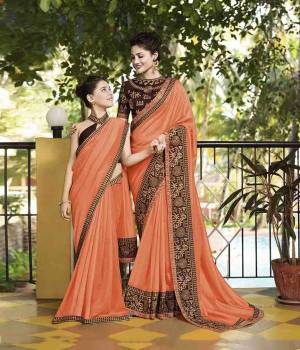 Celebrate This Festive Season with Beauty And Comfort Wearing This Designer Silk Based Saree In Orange Color Paired With Brown Colored Blouse. It Has Attractive And Heavy Embroidered Lace Border. 