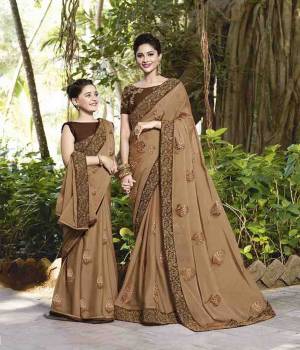 Here Is A Very Pretty Designer Saree In Light Brown Color Paired With Brown Colored Blouse. This Saree Is Fabricated On Chiffon Paired With Art Silk Fabricated Blouse. It Has Very Pretty Tone To Tone Embroidery. 