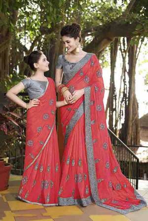 Add This Very pretty Saree To Your Wardrobe For The Upcoming Festive Season In Old Rose Pink Color Paired With Grey Colored Blouse. This Heavy Embroidered Saree Is Satin Based Paired With Art Silk Fabricated Blouse. 