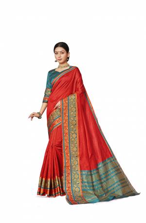 Grab This Rich And Elegant Looking Silk Based Saree In Red Color Paired With Contrasting Blue Colored Blouse. This Saree And Blouse Are Fabricated On Art Silk Beautified With Weave Lace Border. Buy Now.