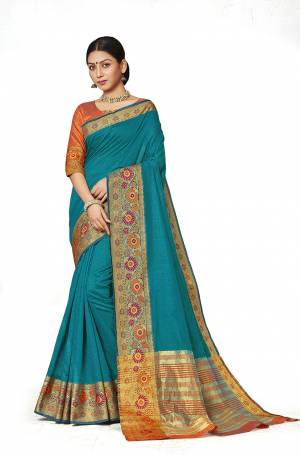 Celebrate This Festive Season With Beauty And Comfort Wearing This Designer Silk Based Saree In Blue Color Paired With Contrasting Orange Colored Blouse. This Saree And Blouse are Fabricated On Art Silk Beautified With Weaved Border. 