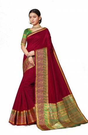 Grab This Rich And Elegant Looking Silk Based Saree In Maroon Color Paired With Contrasting Green Colored Blouse. This Saree And Blouse Are Fabricated On Art Silk Beautified With Weave Lace Border. Buy Now.