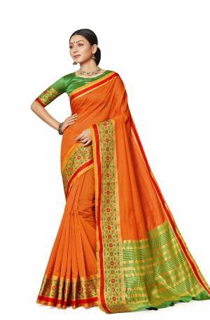 Grab This Rich And Elegant Looking Silk Based Saree In Orange Color Paired With Contrasting Green Colored Blouse. This Saree And Blouse Are Fabricated On Art Silk Beautified With Weave Lace Border. Buy Now.