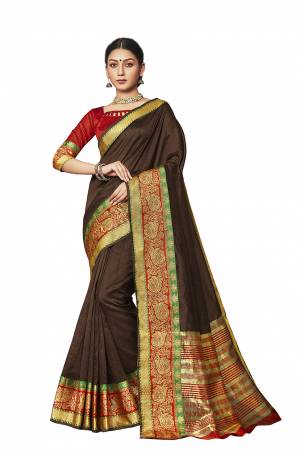 Celebrate This Festive Season With Beauty And Comfort Wearing This Designer Silk Based Saree In Brown Color Paired With Contrasting Red Colored Blouse. This Saree And Blouse are Fabricated On Art Silk Beautified With Weaved Border. 