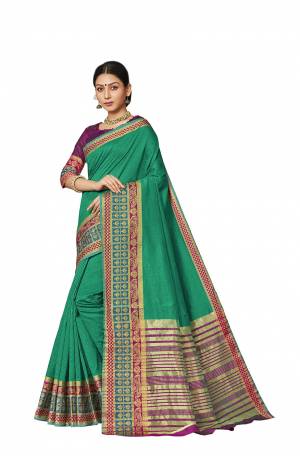Celebrate This Festive Season With Beauty And Comfort Wearing This Designer Silk Based Saree In Sea Green Color Paired With Contrasting Purple Colored Blouse. This Saree And Blouse are Fabricated On Art Silk Beautified With Weaved Border. 