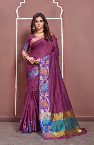 Look Pretty In This Designer Purple Colored Silk Based Saree Paired With Purple Colored Blouse. It Is Beautified With Bold Floral Weave Over The Border. 