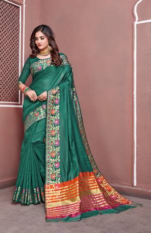 For A Royal Look, Grab This Beautiful Saree In Sea Green Color Paired With Sea Green Colored Blouse. This Saree And Blouse are Silk Based Beautified With Weave Lace Border. 