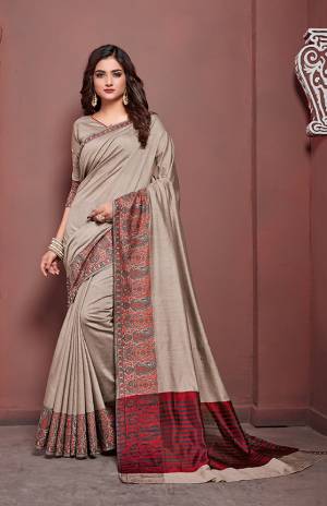 Flaunt Your Rich And Elegant Taste Draping This Very pretty Saree In Grey Color Paired With Grey Colored Blouse. This Saree And Blouse are Silk Based Beautified With Intricate Weave Lace Border.