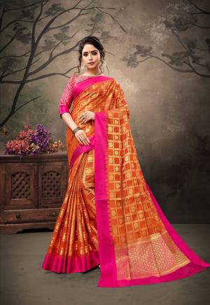 Celebrate This Festive Season With Traditional Color Pallete And Rich Silk with This Saree In Orange Color Paired With Contrasting Dark Pink Colored Blouse. This Saree And Blouse are Fabricated On Banarasi Art Silk Beautified With Weave All Over. 