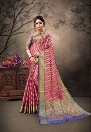 Shine Bright Wearing This Designer Silk Based Saree In Dark Pink Color Paired With Contrasting Violet Colored Blouse. This Saree And Blouse Are Fabricated on Banarasi Art Silk Beautified With Weave. Buy This Saree Now.