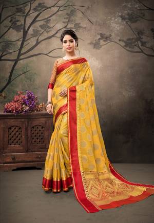 Celebrate This Festive Season With Traditional Color Pallete And Rich Silk with This Saree In Yellow Color Paired With Contrasting Red Colored Blouse. This Saree And Blouse are Fabricated On Banarasi Art Silk Beautified With Weave All Over. 