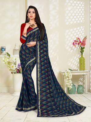 Add This Pretty Saree To Your Wardrobe For Casual Wear In Navy Blue Color Paired With Contrasting Red Colored Blouse. This Saree And Blouse Are Fabricated On Georgette Beautified With All Over Butti Print. It Is Light In Weight And Easy To Carry All Day Long. 