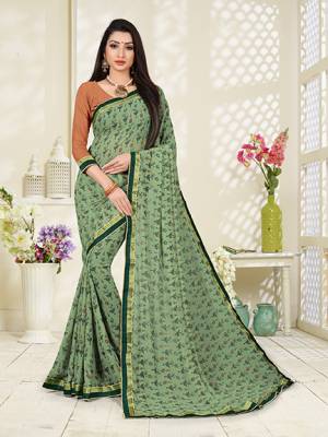 Go With The Pretty Pastel Shades With This Printed Saree In Pastel Green Color Paired With Beige Colored Blouse. This Saree And Blouse Georgette bAsed Beautified With prints.