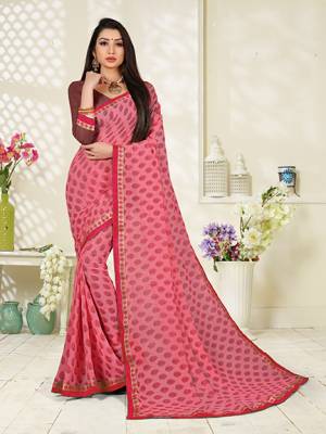 Rich And Elegant Looking Printed Saree Is Here In Pink Color Paired With Brown Colored Blouse. This Saree And Blouse Fabricated on Georgette Beautified With Prints, Its Fabric Ensures Superb Comfort all Day Long. 