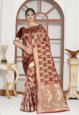 For A Royal Queen Look, Grab This Designer Silk Based Saree In Maroon Color Paierd With Maroon Colored Blouse. This Saree And Blouse Are Fabricated On Art Silk Beautified With Weave All Over. Buy This Saree Now.