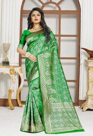 Grab This Simple And Elegent Looking Designer Silk Based Saree In Green Color Paired With Green Colored Blouse. This Saree Is Light Weight, Easy To Drape And Durable. Buy Now.