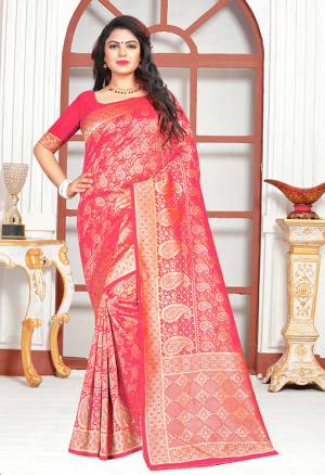 Shine Bright Wearing This Attractive Looking Fuschia Pink Colored Silk Based Saree Paired With Fuschia Pink Colored Blouse. It Is Beautified With Heavy Weave And Also Its Easy To Carry All Day Long. 