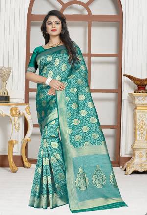 Enhance Your Personality Wearing This Designer Saree In Turquoise Blue Colored Saree Paired With Turquoise Blue Colored Blouse. This Saree And Blouse are Fabricated on Art Silk Which gives A Rich Look To Your Personality. Buy This Saree Now.
