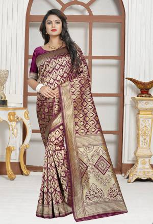 Here Is A Very Pretty Designer Saree In Magenta Pink Color Paired With Magenta Pink Colored Blouse. This Saree And Blouse are Silk Based Beautified With Paisly Weave All Over It. Buy This Saree Now.