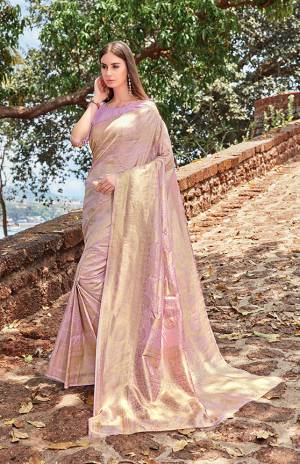 Grab This Very Beautiful Heavy Weaved Designer Silk Based Saree In Lilac Color. This Pretty Saree Is Fabricated On Jacquard Silk Paired With Art Silk Fabricated Blouse. This Saree Is Suitable For Any Festive Wear Or Social Function.