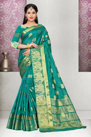 Grab This Pretty Saree In Sea Green Color Paired With Sea Green Colored Blouse. This Saree And Blouse are Fabricated On Cotton Silk Beautified With Folk Design Weave. Buy This Saree Now.