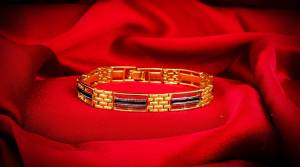 Give An Elegant Look To Your Wrist Wearing This Designer Bracelet In Golden Color Beautified With Stone Work. This Bracelet Can Be Paired With Any Colored And Type Of Attire, Buy Now