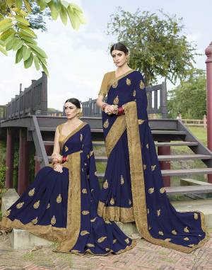 Enhance Your Personality In This Rich And Elegant Looking Designer Saree With Minimal Embroidery In Dark Blue Color Paired With Beige Colored Blouse. This Saree Is Georgette Based Paired With Art Silk Fabricated Blouse. 