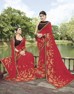 Adorn The Pretty Angelic Look Wearing This Very Beautiful Designer Saree In Red Color Paired With Brown Colored Blouse. This Saree Is Georgette Based Paired With Art Silk Fabricated Blouse. Buy Now.