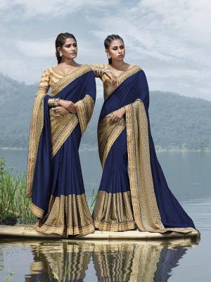Enhance Your Perosnlity In This Rich And Elegant Looking Designer Saree In Navy Blue Color Paired With Beige Colored Blouse. This Saree Is Fabricated On Fancy Art Silk Paired With Art Silk Fabricated Blouse. It Has Attractive Lace Border And Heavy Blouse. 
