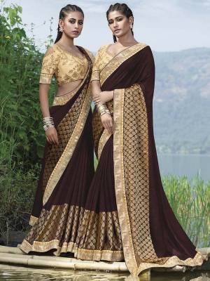 Rich And Elegant Looking Designer Saree Is Here In Brown Color Paired With Beige Colored Blouse. This Saree Is Fancy Fabric Based On Silk Paired With Art Silk Fabricated Blouse. Its Rich Color Pallete And Fabric Will Earn You Lots Of Compliments From onlookers .