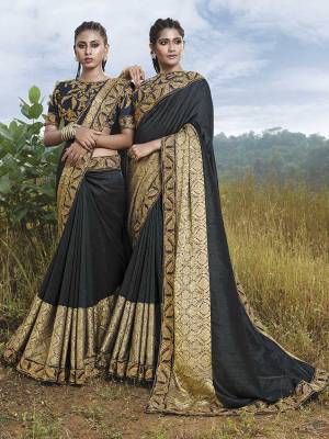 Flaunt Your Rich And Elegant Taste Wearing This Designer Saree In Dark Grey Color. It Is Fancy Art Silk Fabricated With Silk Base. It Has Attractive Lace Border And Embroidered Blouse Which Gives Rich look To Your Personality. 
