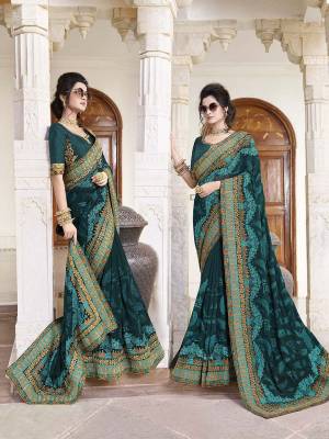 New Shade IS Here To Add Into Your Wardrobe With This Designer Saree In Teal Blue Color Paired With Teal Blue Colored Blouse. This Saree Is Georgette Based Paired With Art Silk Fabricated Blouse. Buy Now.
