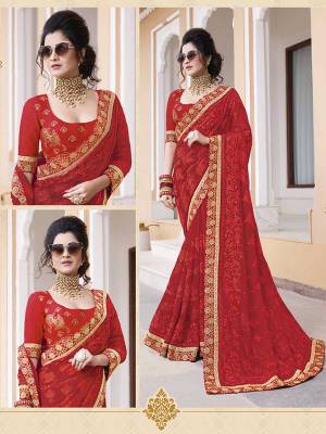 Adorn The Pretty Angelic Look In This Very Pretty Designer Saree In Red Color paired With Red Colored Blouse. This Saree IS Fabricated On Georgette Beautified With Tone To Tone Work Paired With Art Silk Fabricated Blouse. 