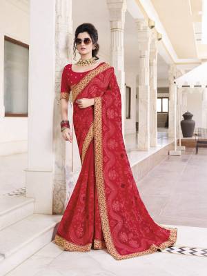 Adorn The Pretty Angelic Look In This Very Pretty Designer Saree In Red Color paired With Red Colored Blouse. This Saree IS Fabricated On Chiffon Beautified With Tone To Tone Work Paired With Art Silk Fabricated Blouse. 