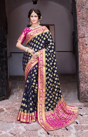 Enhance Your Personality Wearing This Heavy Weaved Saree In Navy Blue Color Paired With Contrasting Rani Pink Colored Blouse. This Saree And Blouse Are Fabricated on Nylon Art Silk Beautified With Weaving And Stone Work. Buy This Pretty Saree Now.